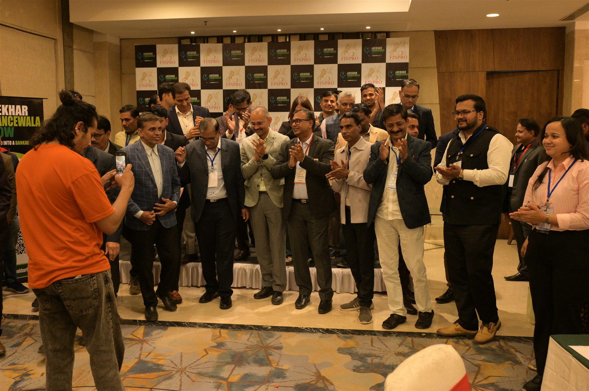 FINMEET guests applauding at the close of the event